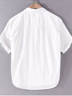 White short sleeve button-down shirt with a clean cut and gathered back detail.