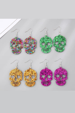 Glitter skull starburst dangle earrings in multicolor, green, gold, and red-violet acrylic.