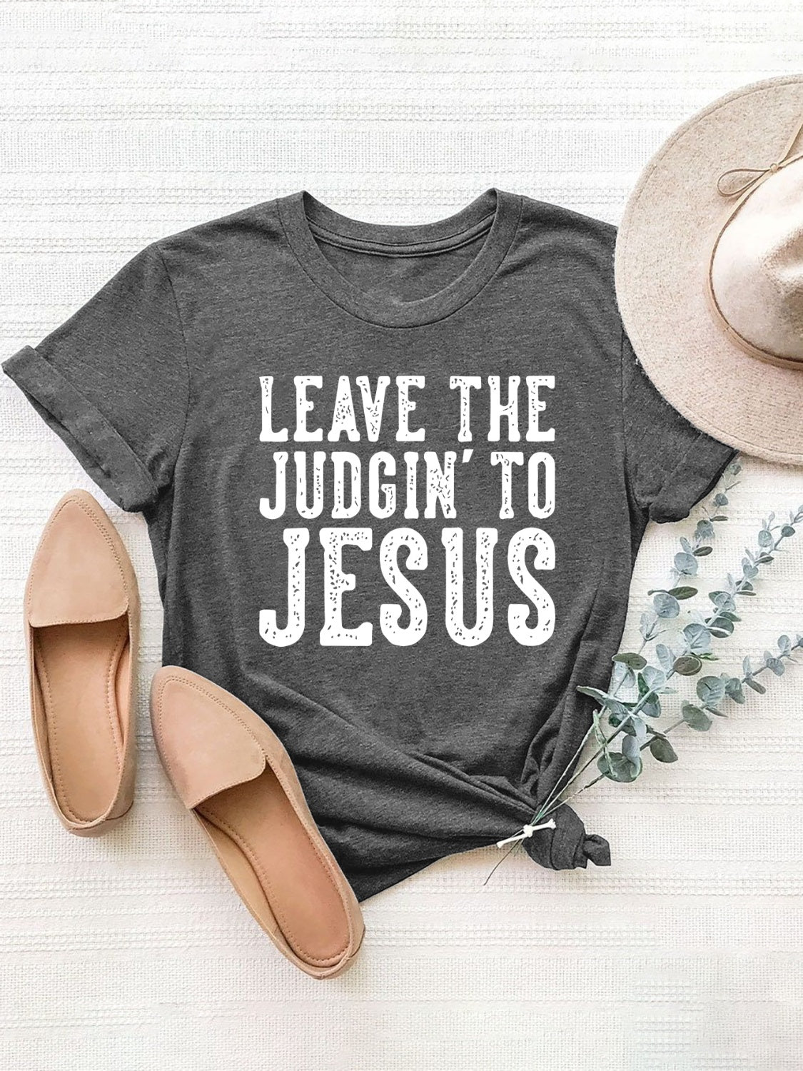 Dark gray graphic tee with white lettering that says "LEAVE THE JUDGIN' TO JESUS". Relaxed fit.