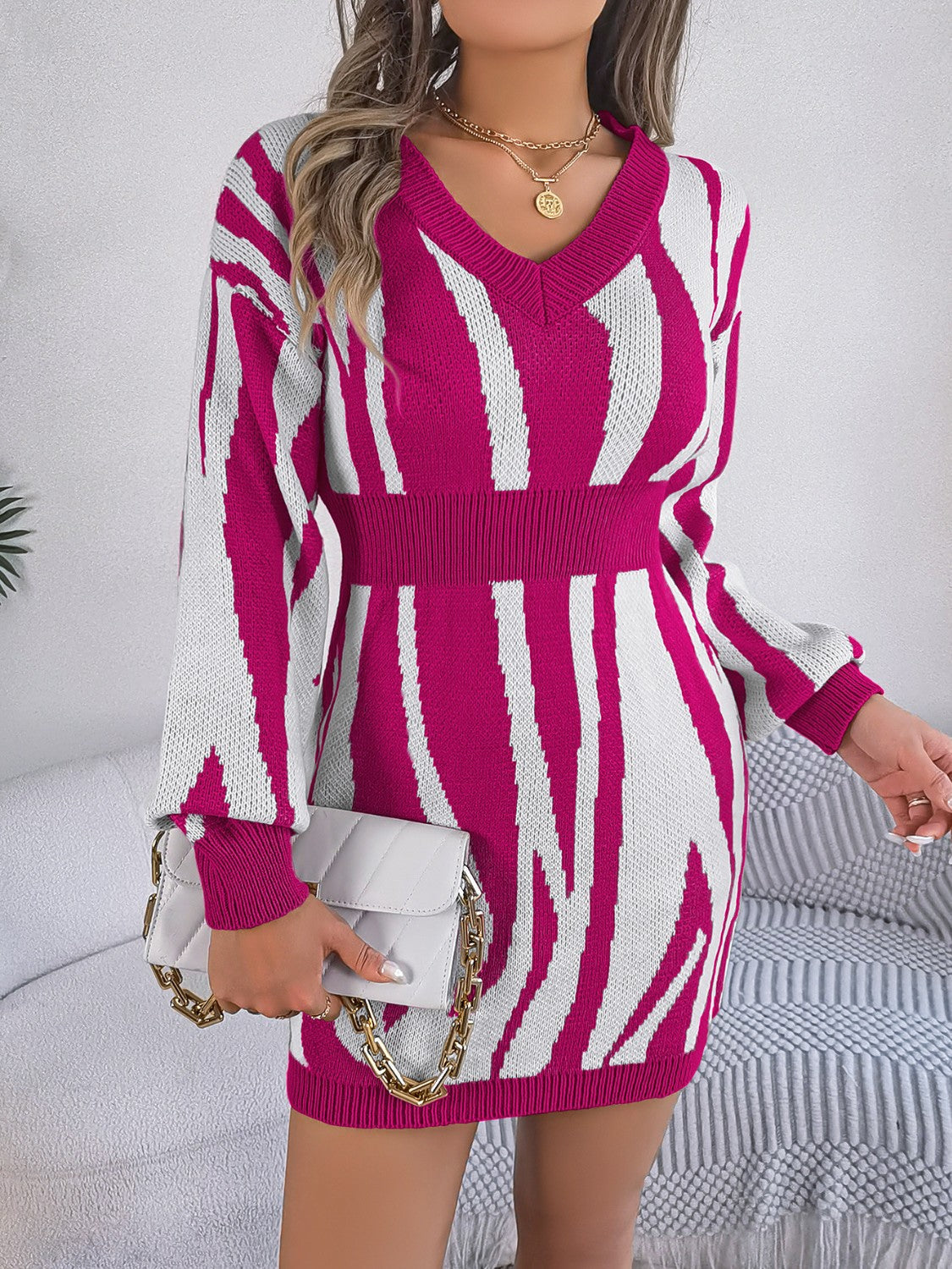 Zebra stripe knit fit-and-flare dress in cerise with V-neck and long sleeves