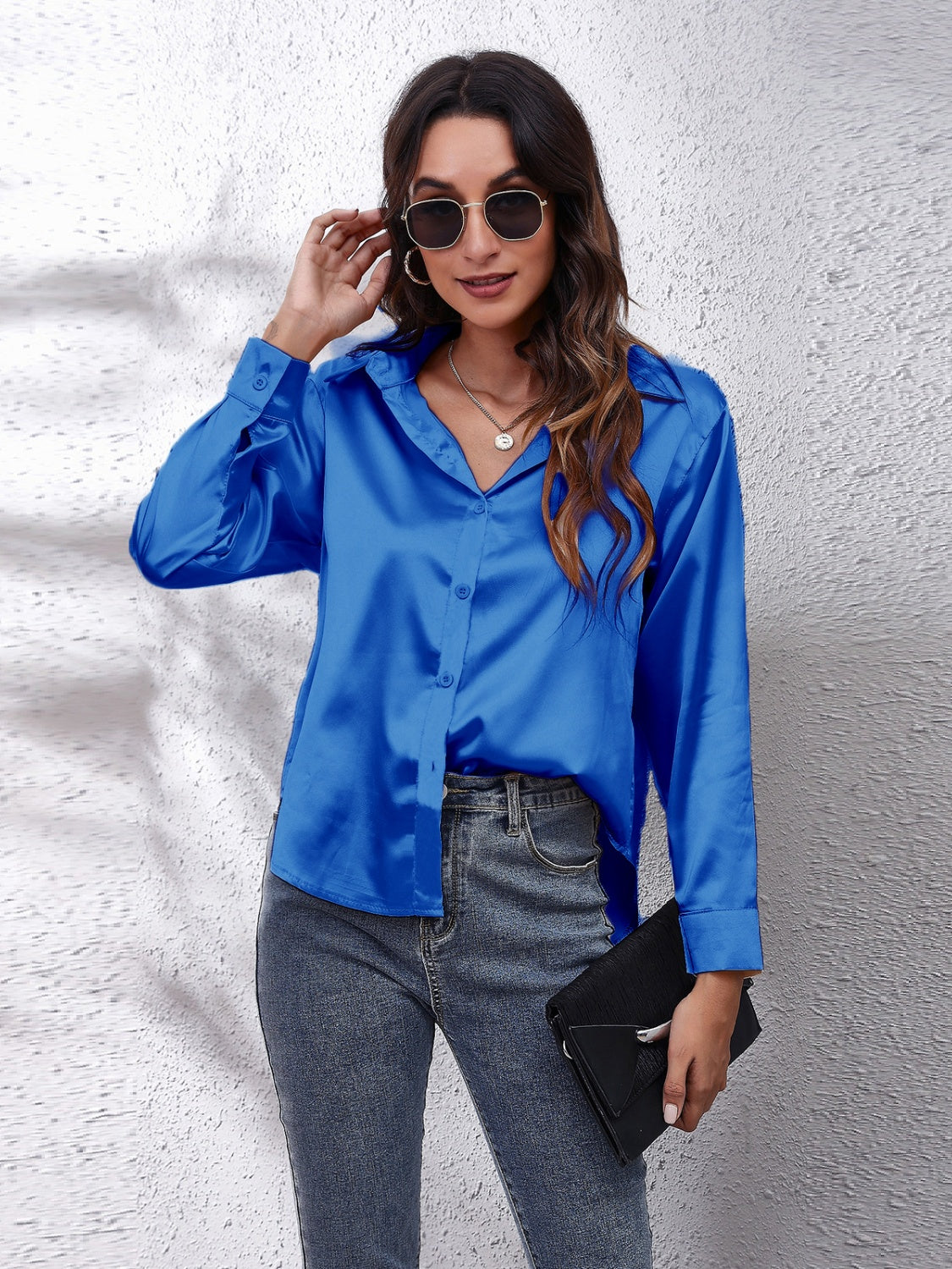 Royal blue silken button-down shirt with a relaxed fit and collared neckline.
