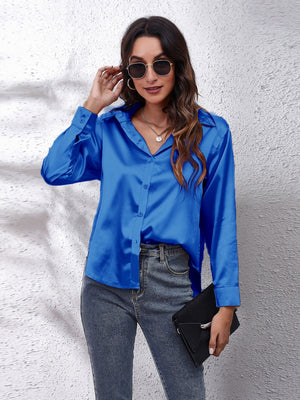 Royal blue silken button-down shirt with a relaxed fit and collared neckline.