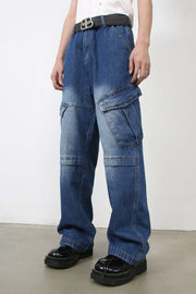 Cargo denim flare trousers in medium wash blue with multiple pockets and a relaxed fit.