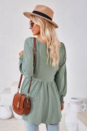 Textured babydoll blouse in Sage with smocked cuffs and square neckline.