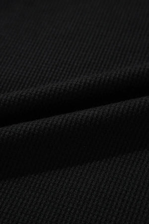Black textured ribbed loungewear fabric detail