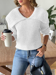 White ribbed knit sweater with shawl collar and long sleeves.