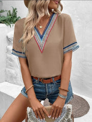 Mocha V-neck top with colorful embroidered trim on neckline and sleeves.