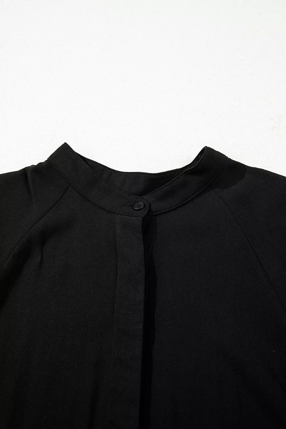 Black maternity maxi dress with mandarin collar and hidden placket detail.