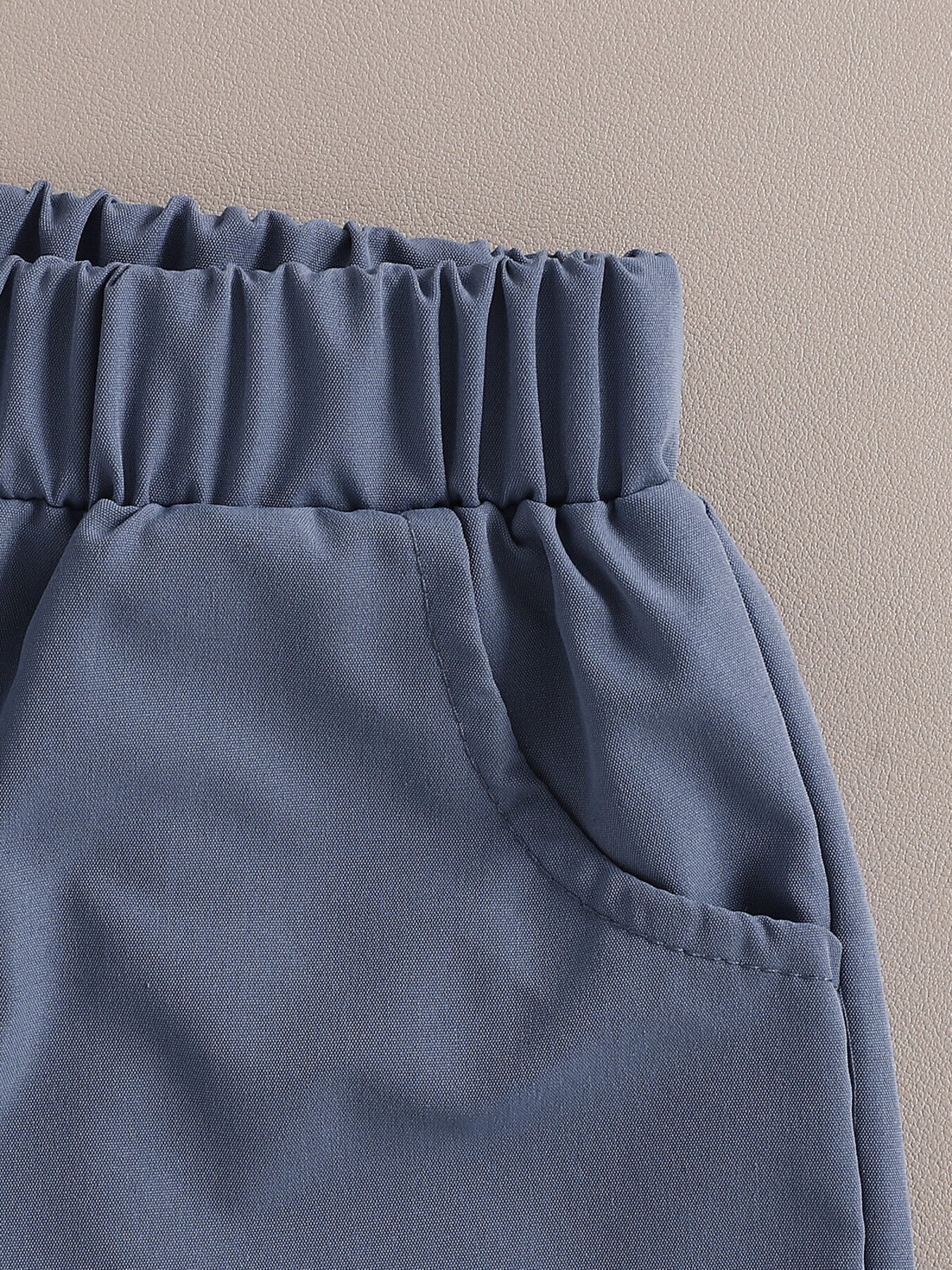 Toddler outfit set in royal blue cotton with elastic waistband and functional pockets.
