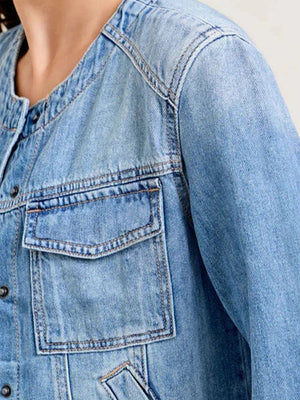 Light wash denim utility jacket with band collar and chest cargo pocket.
