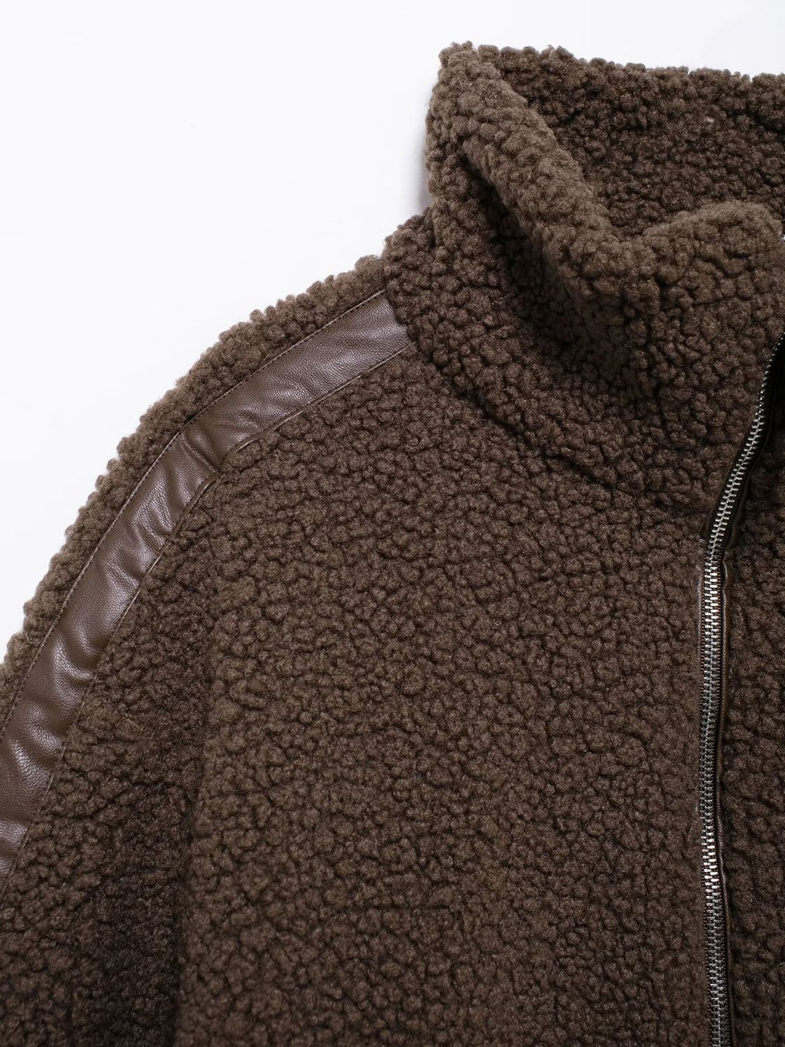 Dark brown teddy fleece zip-up jacket with faux leather contrast piping detail.
