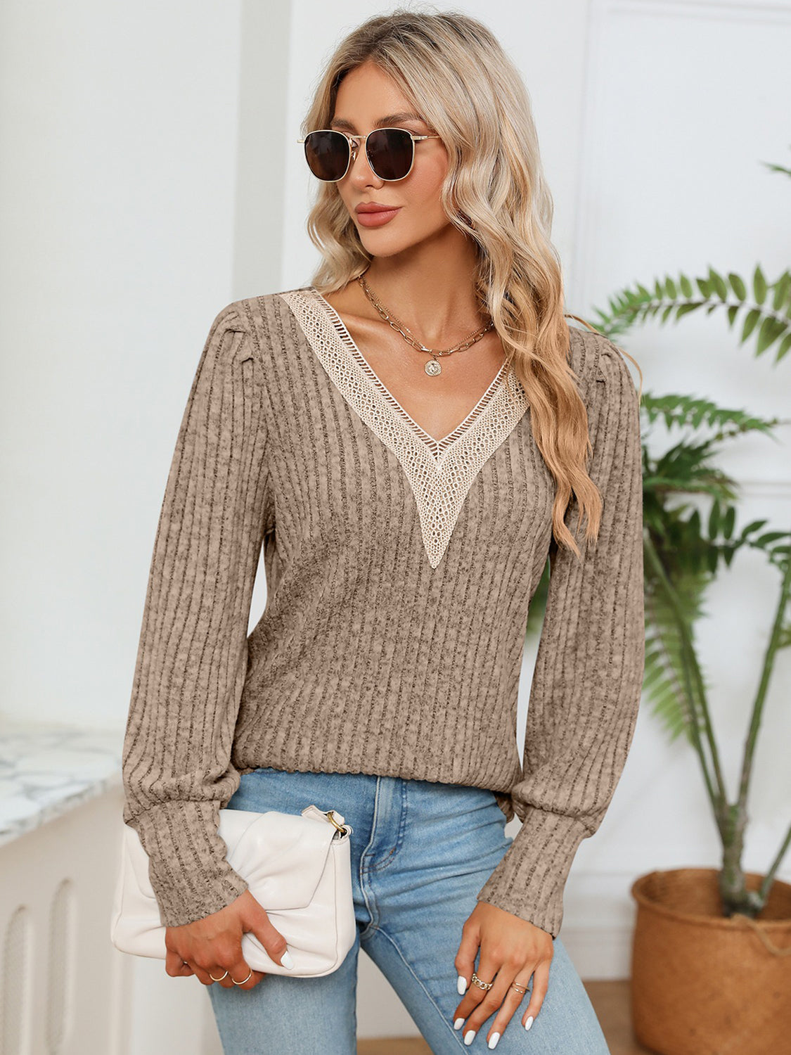 Khaki ribbed knit sweater with crochet V-neck detail and long sleeves