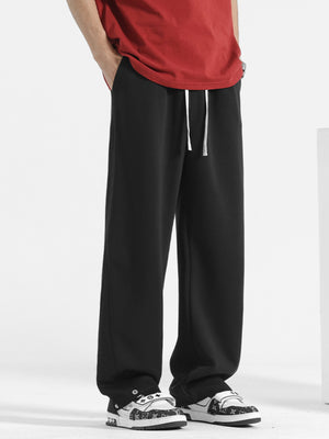 Men's black sweatpants with drawstring and wide leg