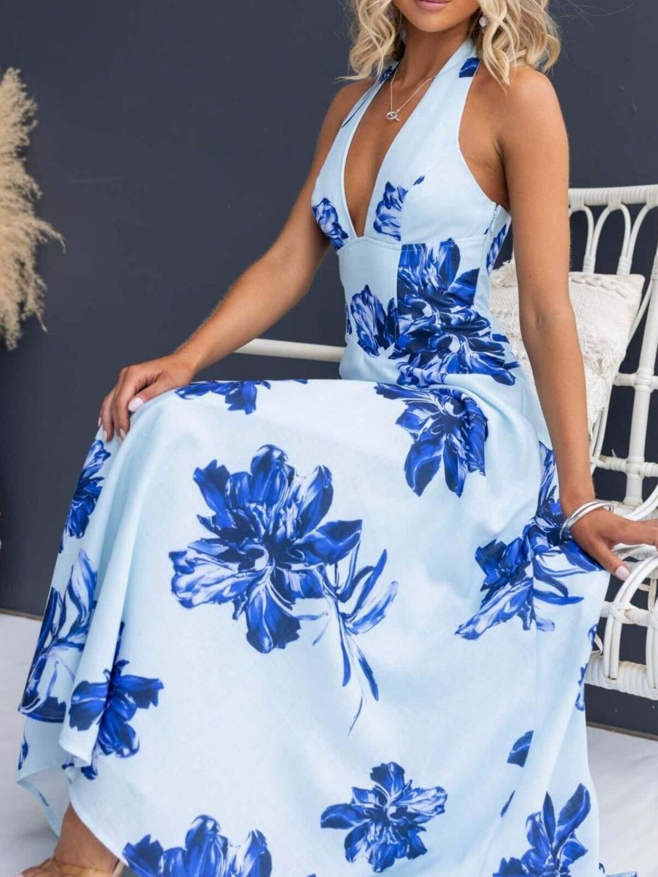 Light blue floral halter neck maxi dress with a deep V-neckline.