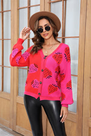 Strawberry patchwork V-neck cardigan in hot pink and red acrylic with button front.