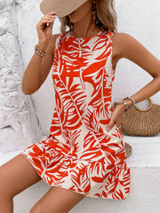 Tropical leaf print mini dress with ruffle hem and sleeveless design.