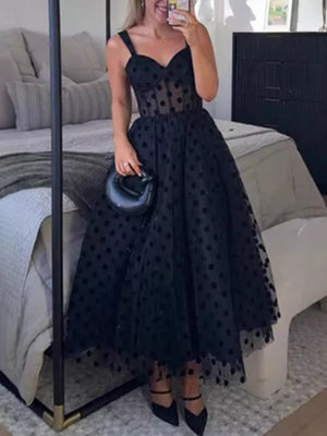 Black polka dot tulle dress with sweetheart neckline and spaghetti straps.