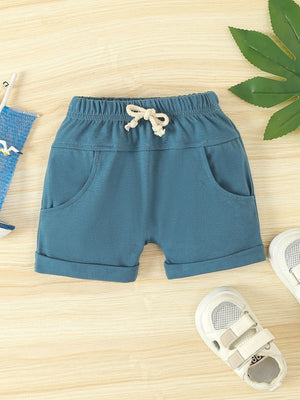 Sky blue cotton shorts with drawstring and cuffed hem.