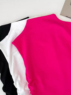 Textured ruching mock neck tank top in bright pink, black, and white.