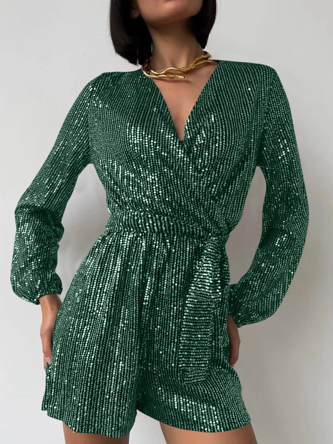 Dark green sequin wrap romper with blouson sleeves and V-neck