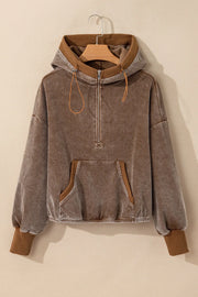 Brown corduroy half-zip hoodie with voluminous sleeves and a front pocket.