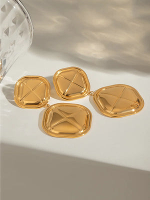 Gold 18K gold-plated drop earrings with sculpted geometric design and polished finish.