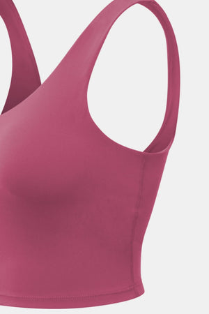 Performance scoop crop top in Deep Rose with racerback straps and a seamless finish.