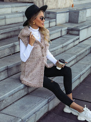 Mocha teddy sherpa utility vest with button front and collar, worn by a woman with a black hat.