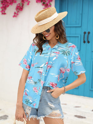 Sky blue camp collar shirt with tropical flamingo and palm tree print, short sleeves