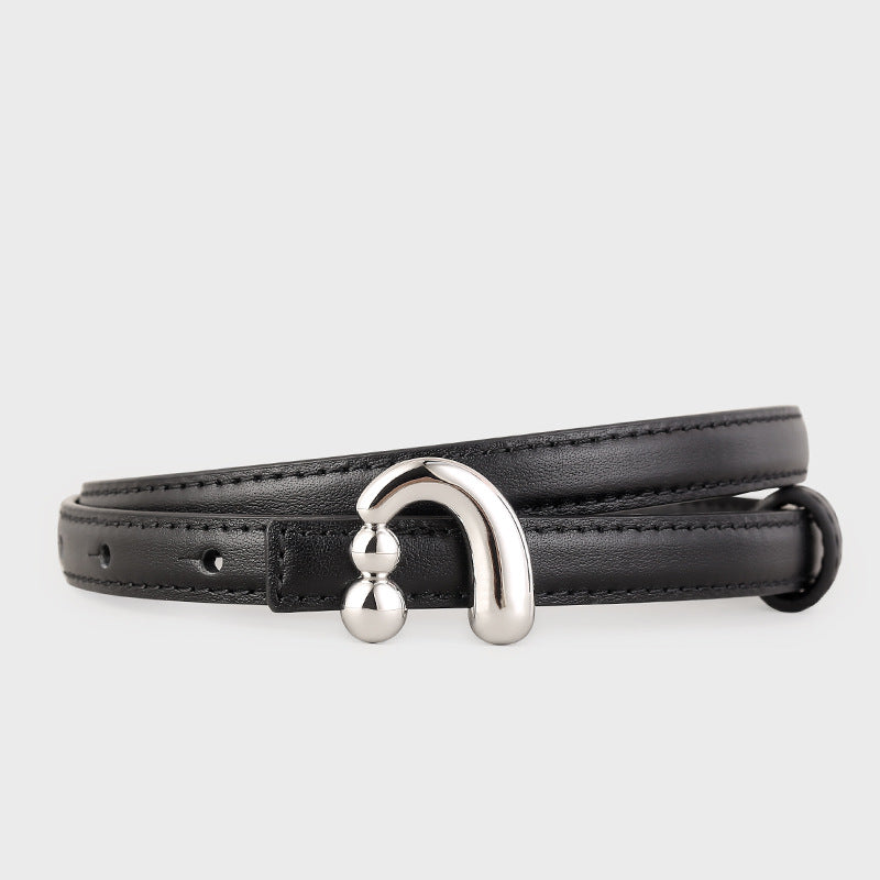 Black skinny leather belt with a silver U-shaped buckle and double ball detail.