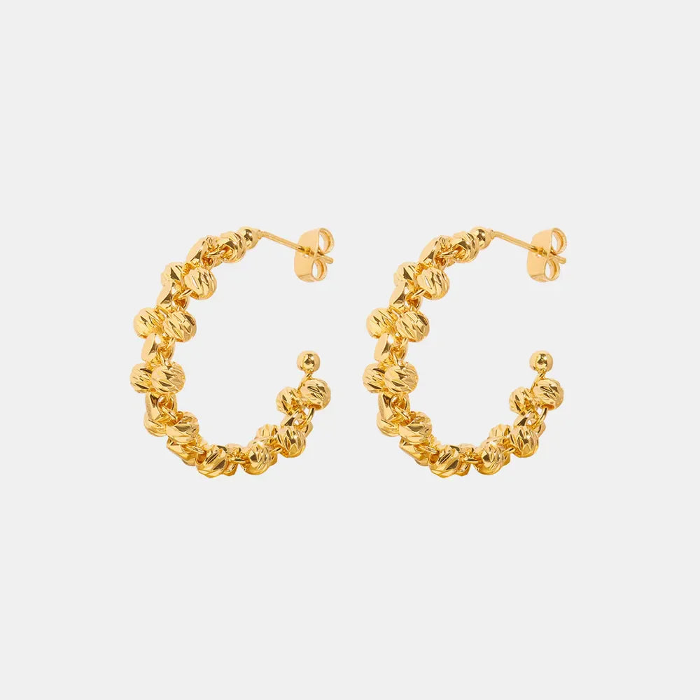 Textured orb C-hoop earrings in gold with a unique beaded design.