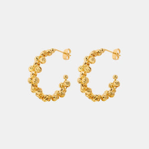Textured orb C-hoop earrings in gold with a unique beaded design.