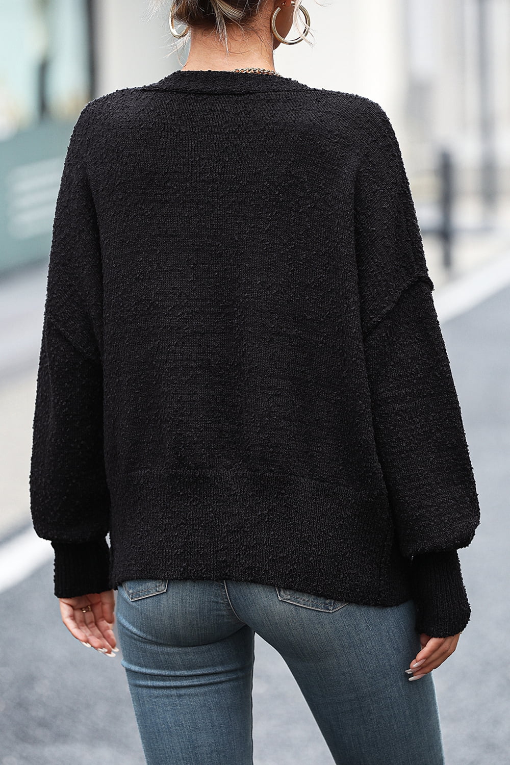 Black textured bouclé button-down cardigan with balloon sleeves