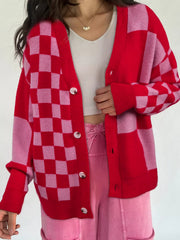 Checkerboard knit cardigan in deep rose with button front and ribbed cuffs.