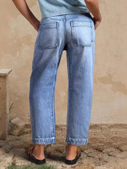 Relaxed high-waisted denim jeans with cuffed hem and back pockets.