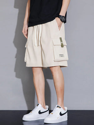 Khaki cargo shorts with drawstring waist and utility pocket detail.