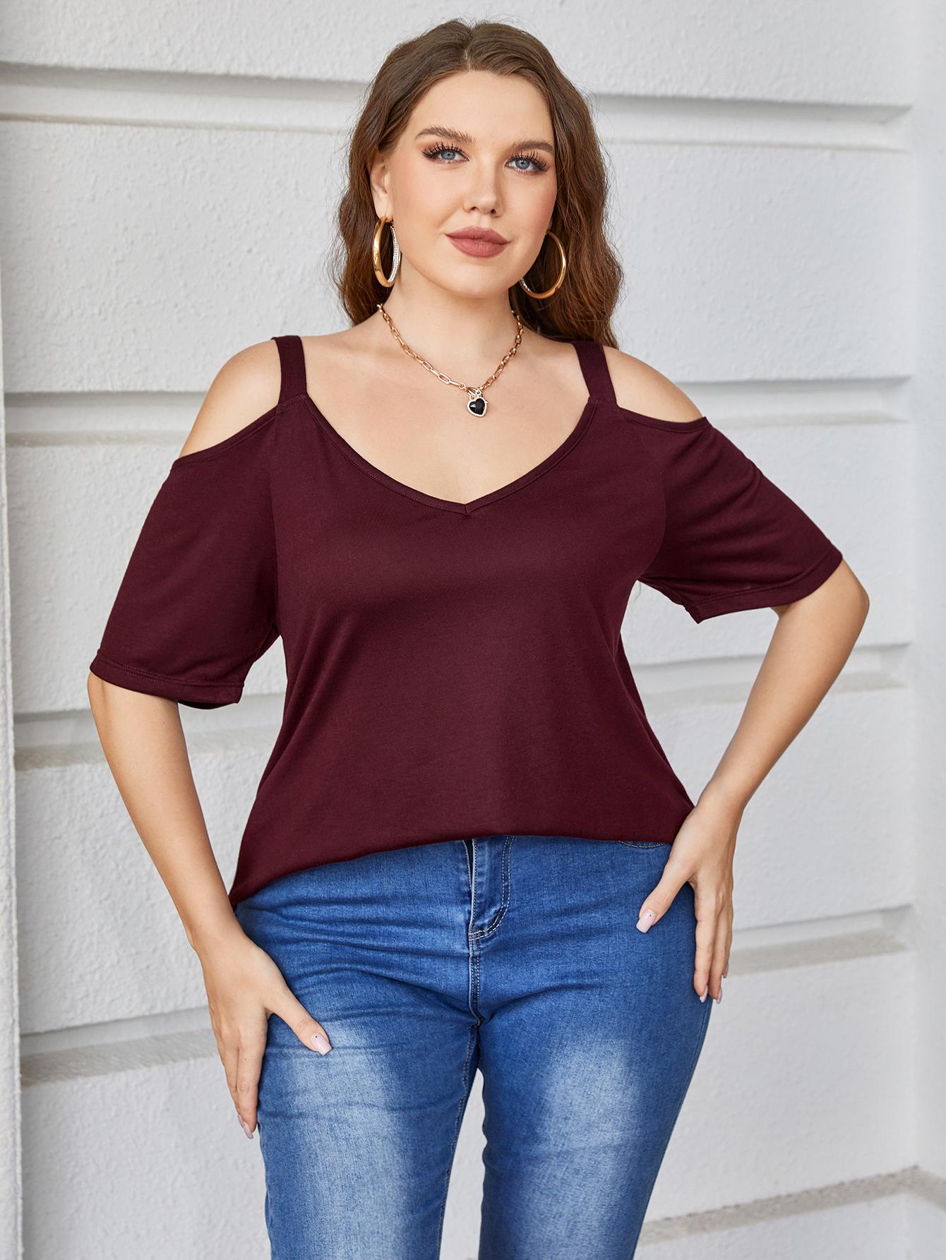 Burgundy cold shoulder v-neck top with short sleeves.