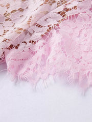 Powder floral lace dress detail with fringed hem.