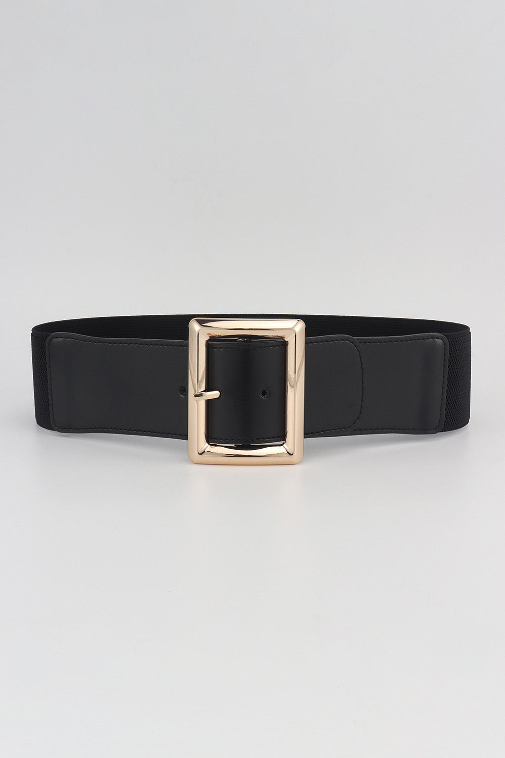 Black elastic belt with a wide gold-tone sculptural buckle.
