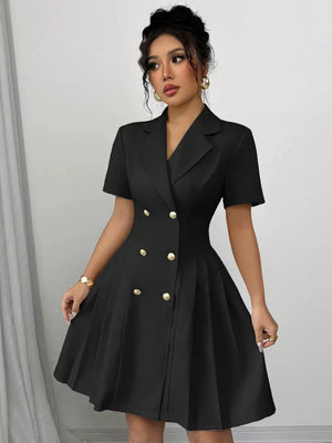 Black double-breasted pleated blazer dress with gold buttons and short sleeves.