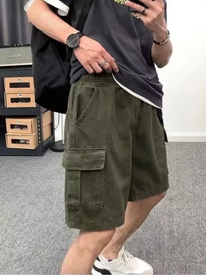 Men's green cotton cargo shorts with multiple pockets and elastic waistband.