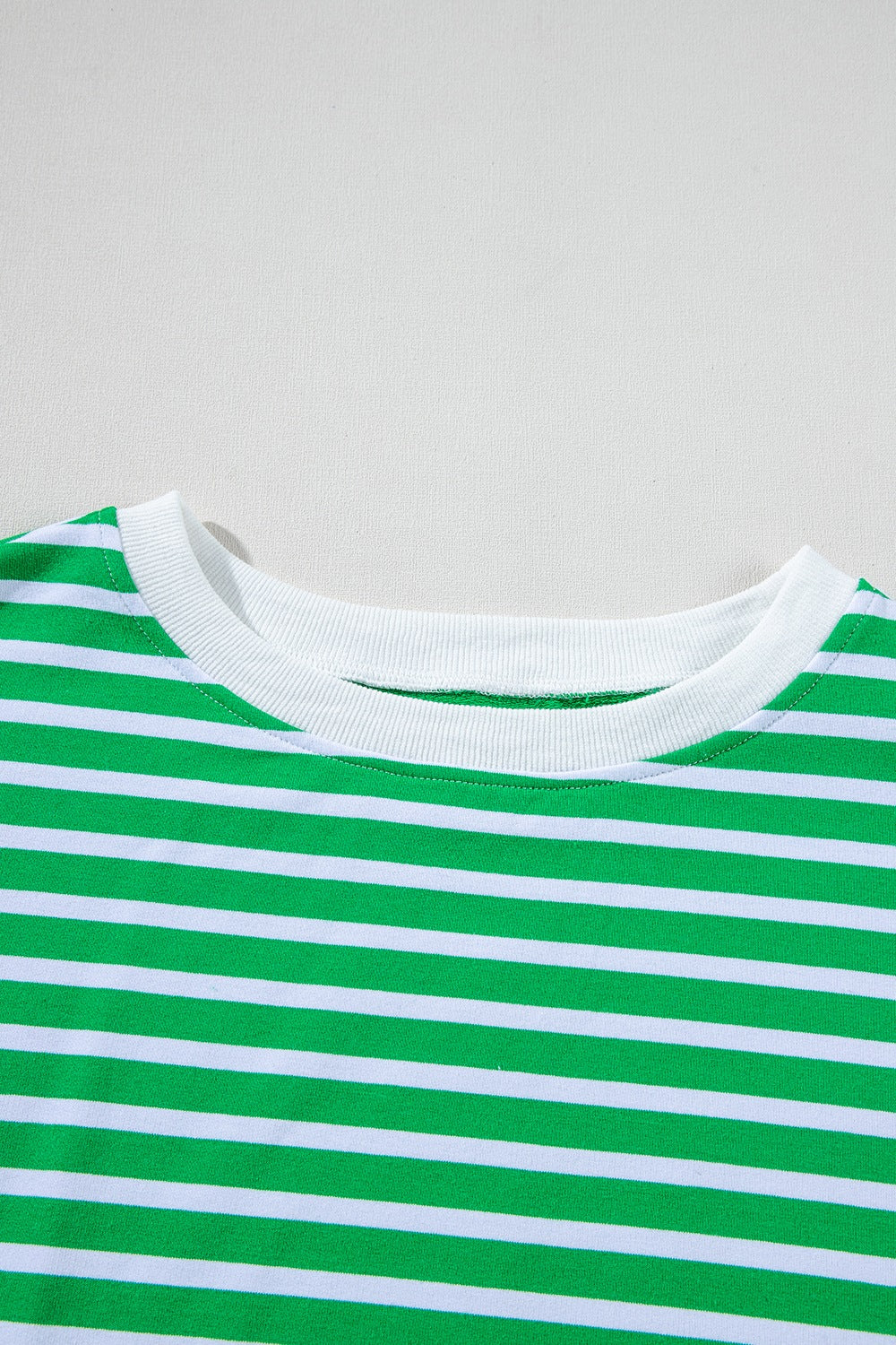 Green and white striped cotton loungewear top with crew neck.