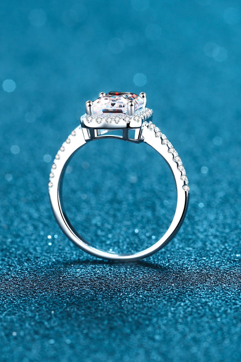 Silver radiant cushion cut halo ring with pave band