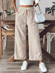 Chic high-waisted striped wide-leg pants in beige and white, with a relaxed fit.