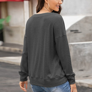 Dark gray sweatshirt with drop shoulders and crew neck, casual long sleeves