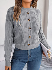 Charcoal cable knit button-up sweater with mock neck and tortoise buttons.