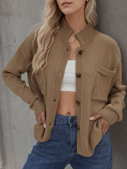 Camel stand collar knit cardigan with buttons and chest pocket.