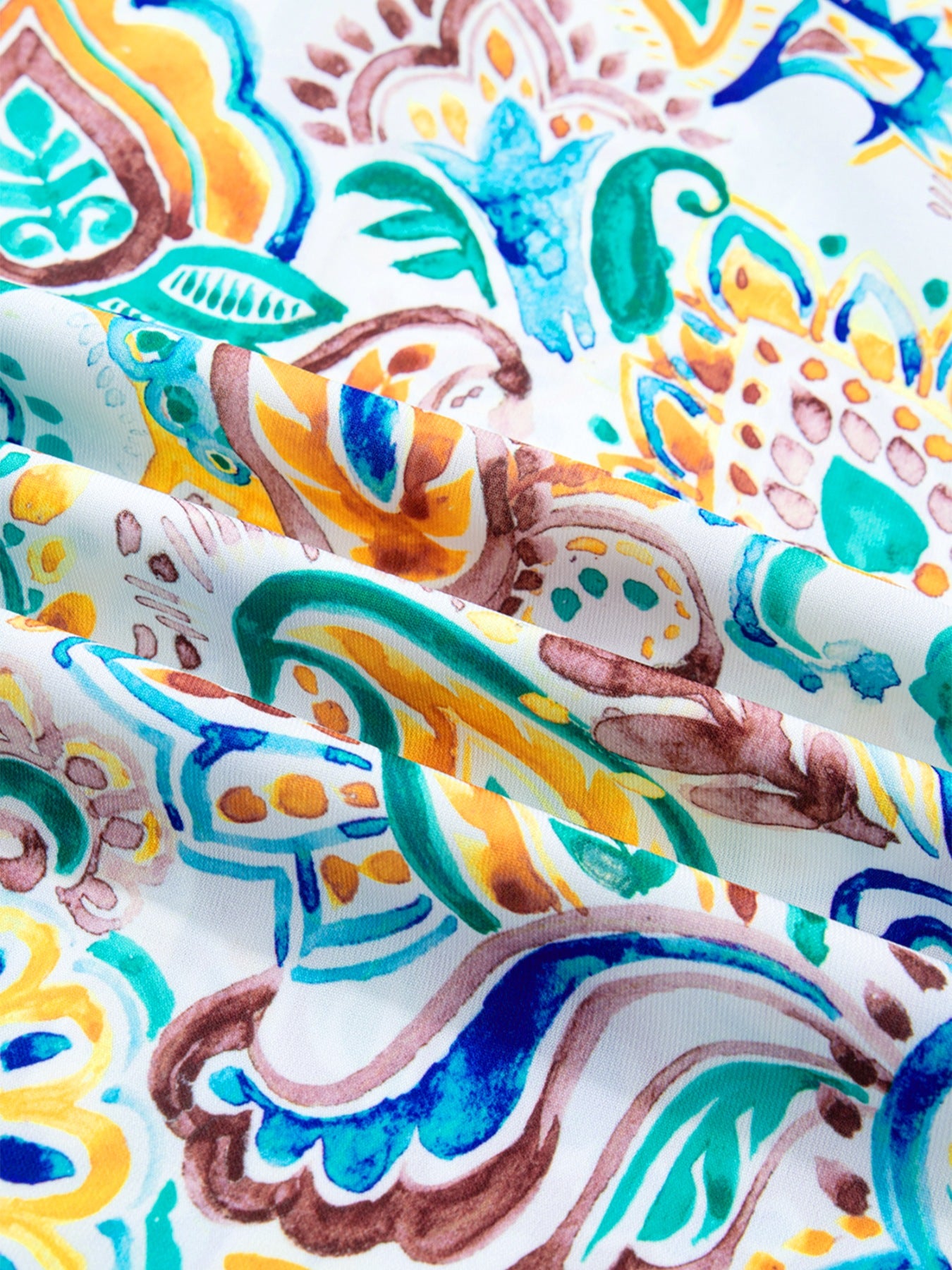 Paisley floral puff sleeve shirt in white with blue, green, yellow, and brown watercolor print.