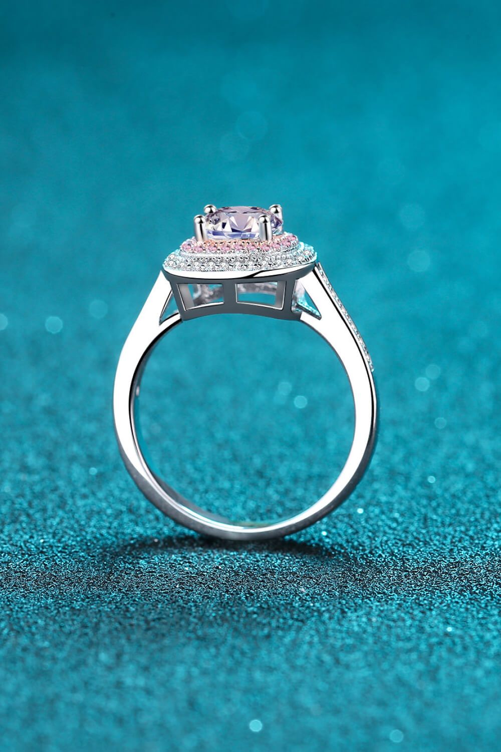 Silver ring with halo moissanite and pink diamond accents