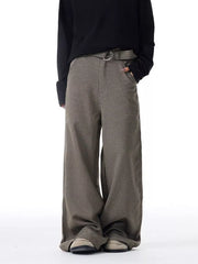 Men's wide-leg sweatpants in brown check with pockets and a belt.